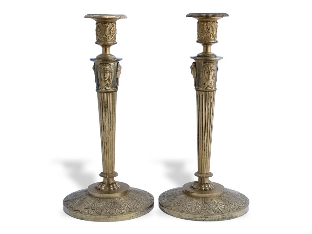 Null Pair of ormolu FLAMPS, the fluted shaft topped with Egyptian heads

19th ce&hellip;