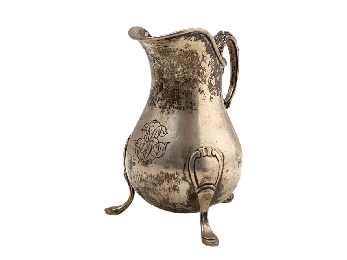 Null A plain silver MILK POT, resting on three feet, engraved
Minerve. Goldsmith&hellip;