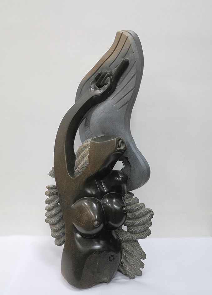 Sculpture contemporaine Shona 当代雕塑 肖纳

深色蛇纹石，部分抛光和打过蜡

津巴布韦

签名：K.恩加姆

36x22x86厘&hellip;