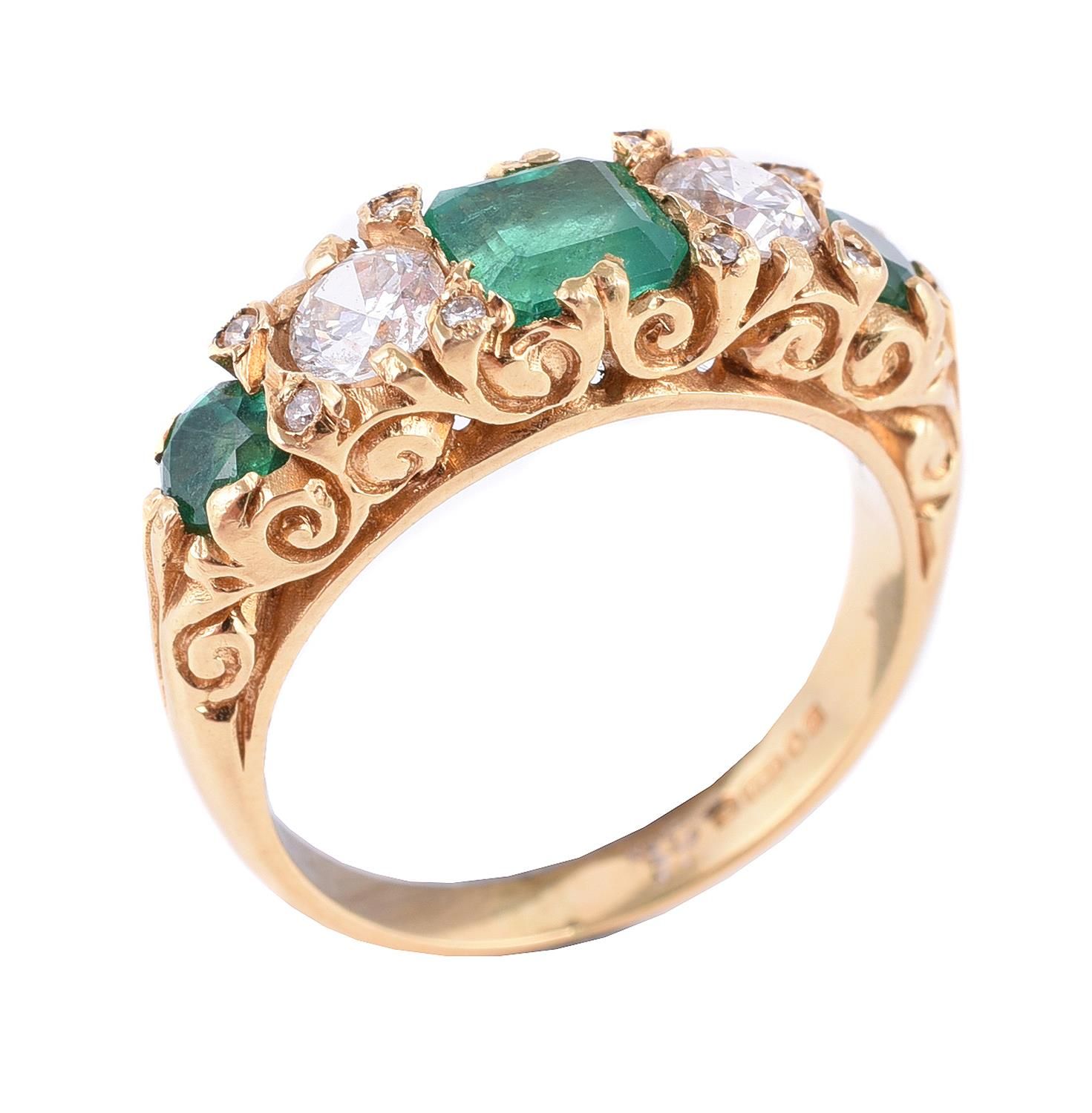 An emerald and diamond five stone ring 一枚祖母绿和钻石的五石戒指，中央的阶梯式切割祖母绿两侧是一对明亮式切割钻石，到圆形&hellip;