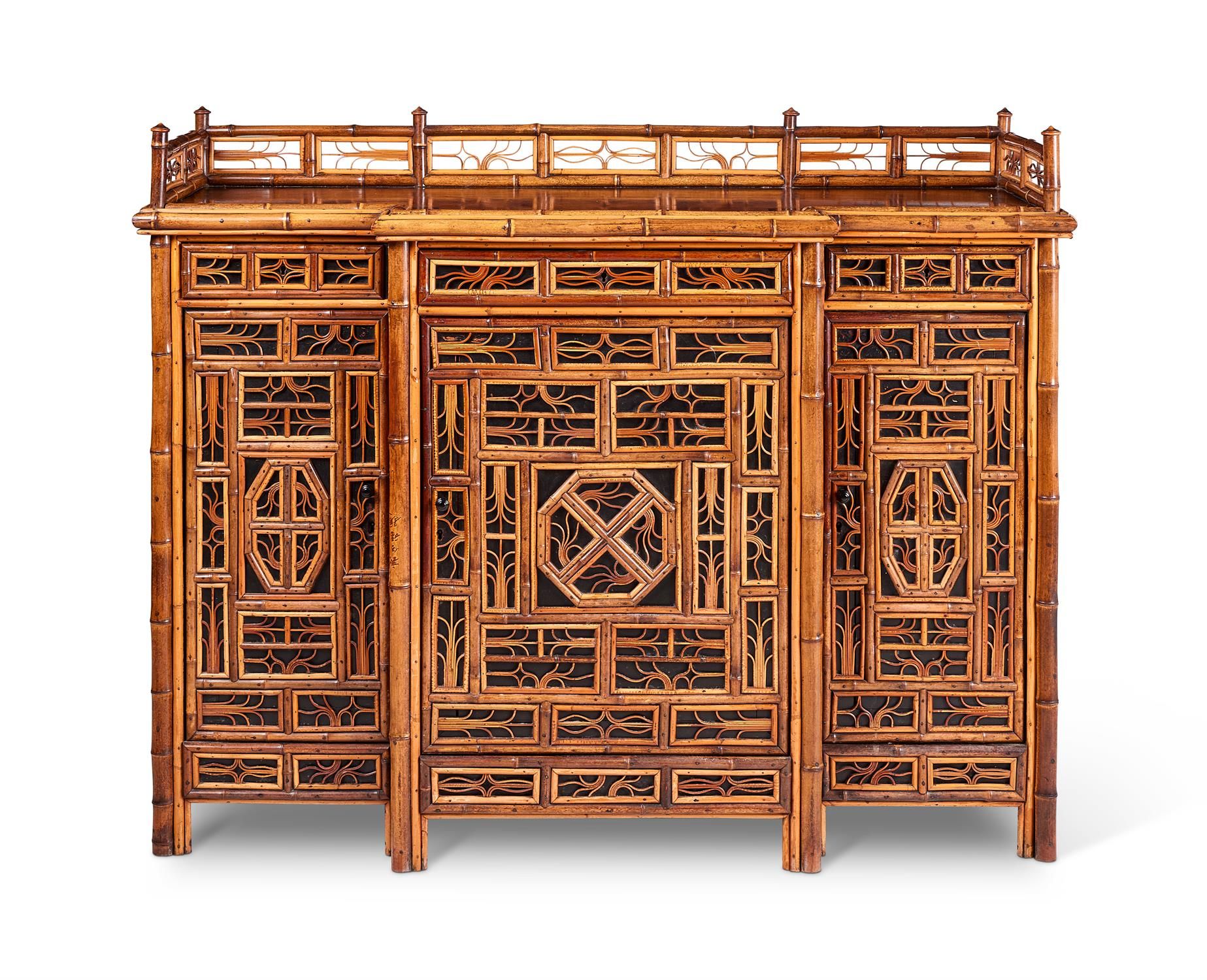 A BAMBOO, RATTAN, WALNUT AND PART EBONISED 'CHINOISERIE' BREAKFRONT SIDE CABINET&hellip;