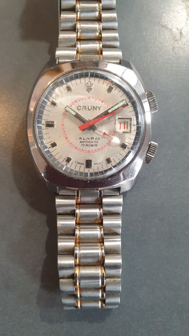 CAUNY PRIMA Alarm, ref. 90.5760 vers 1970. 

Montre bracelet en acier, boitier t&hellip;