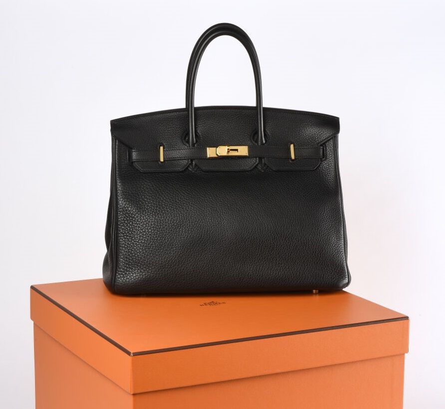 HERMES Birkin bag model 35 in black taurillon Clémence and gold metal trim. 

Th&hellip;