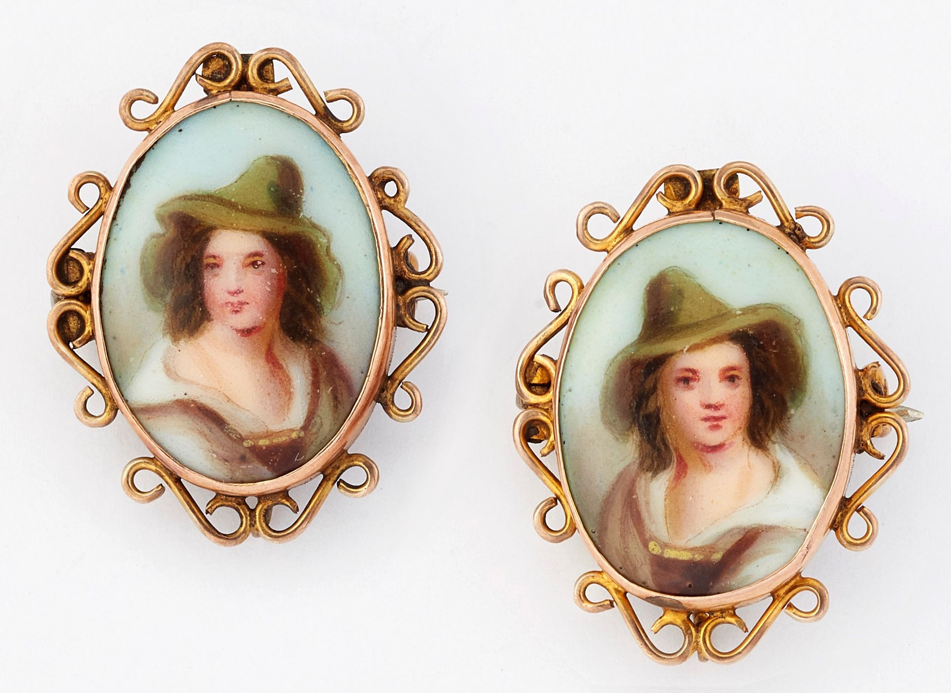 Null A PAIR OF 19TH CENTURY SMALL PORCELAIN BROOCHES, each oval plaque painted d&hellip;