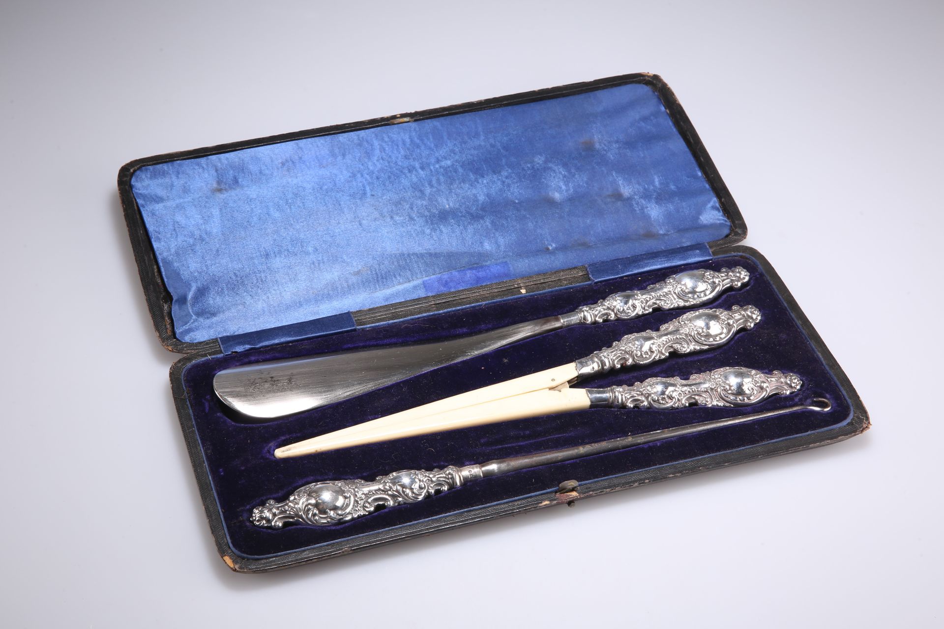 Null A VICTORIAN SILVER-HANDLED SHOE-HORN, GLOVE-STRETCHER AND BUTTON-HOOK SET, &hellip;