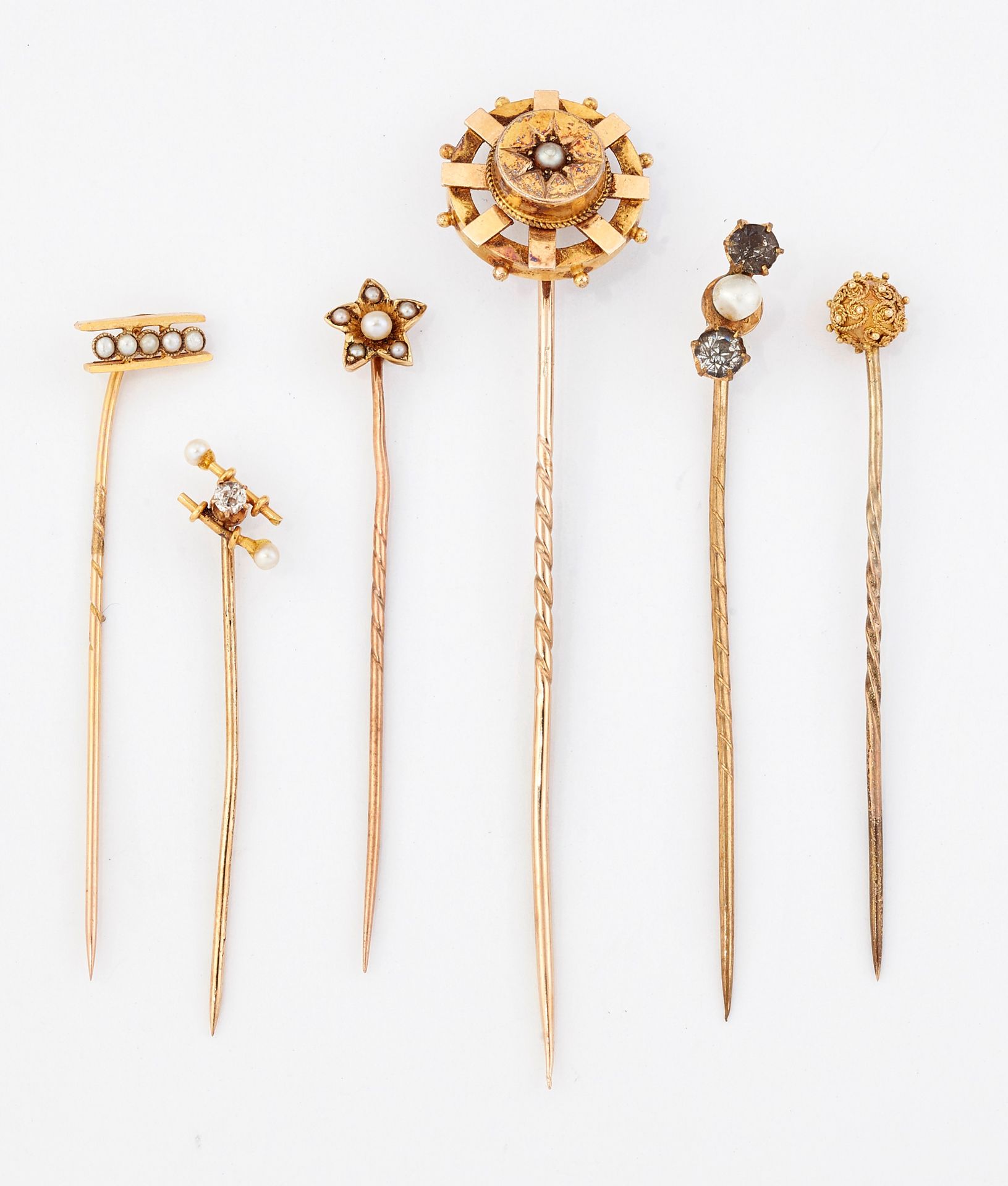 Null A GROUP OF SIX STICK PINS, including; A DIAMOND AND SEED PEARL SET EXAMPLE;&hellip;