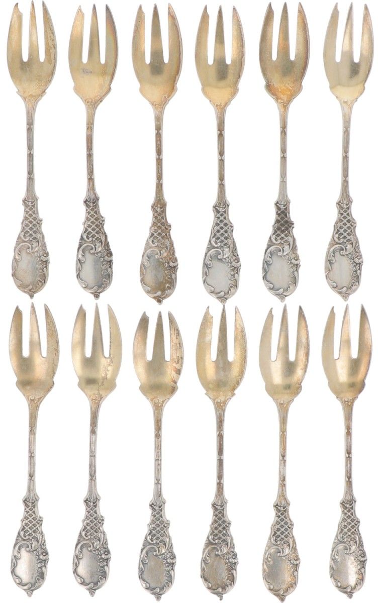 (12) piece set of strudel forks silver. With molded decorations and partly gilde&hellip;