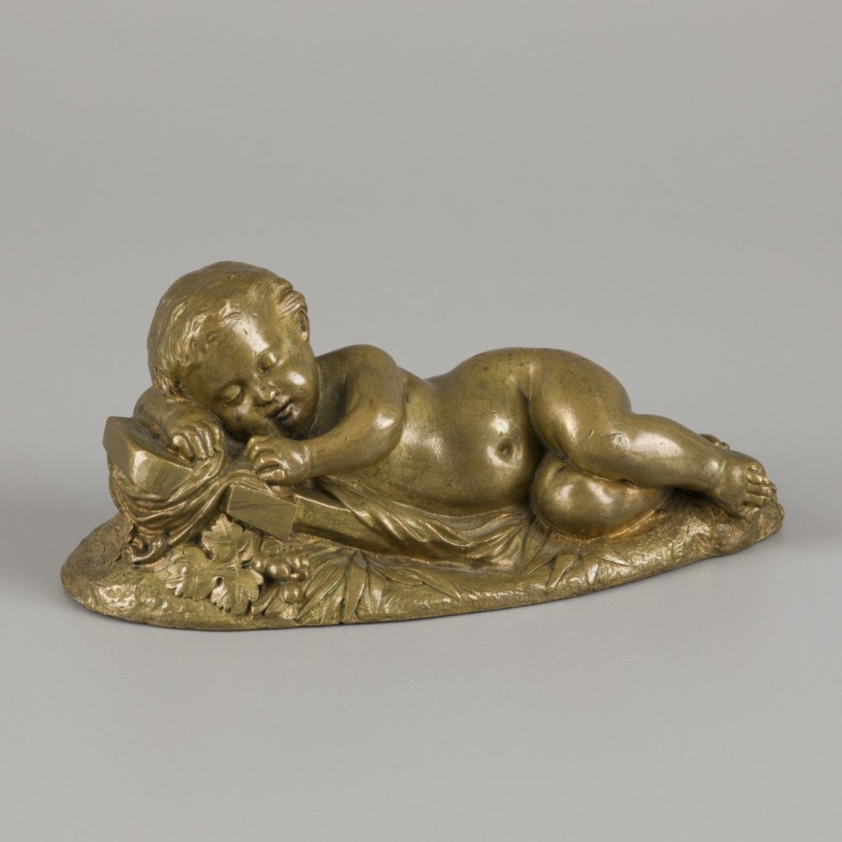 A bronze desk ornament depicting a sleeping child, France, mid. 19th century. Ma&hellip;