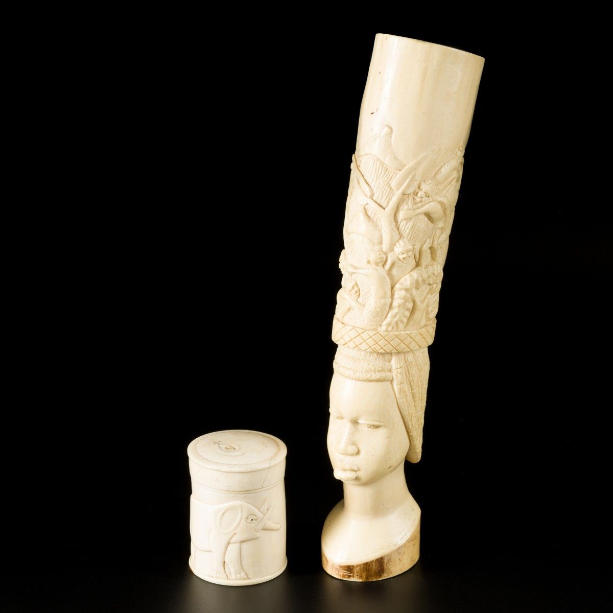Two ivory carvings of a villagescene above a wokmans head, and a lidded pot deco&hellip;
