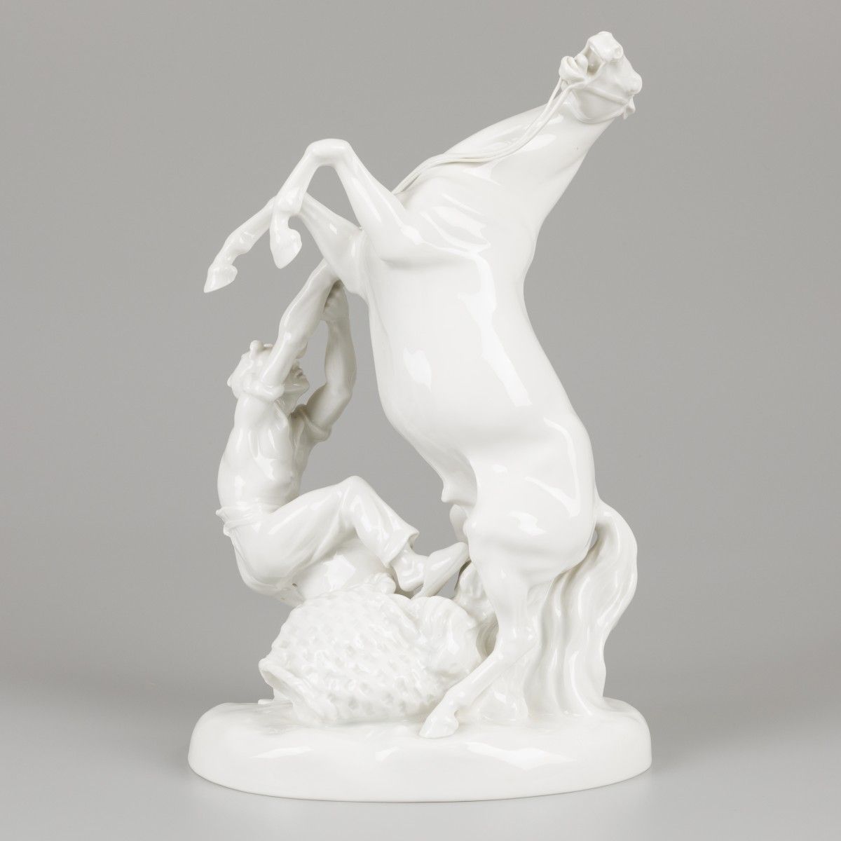 A porcelain equestrian group of a stallion and groom, Erich Oehme (1898-1970) in&hellip;