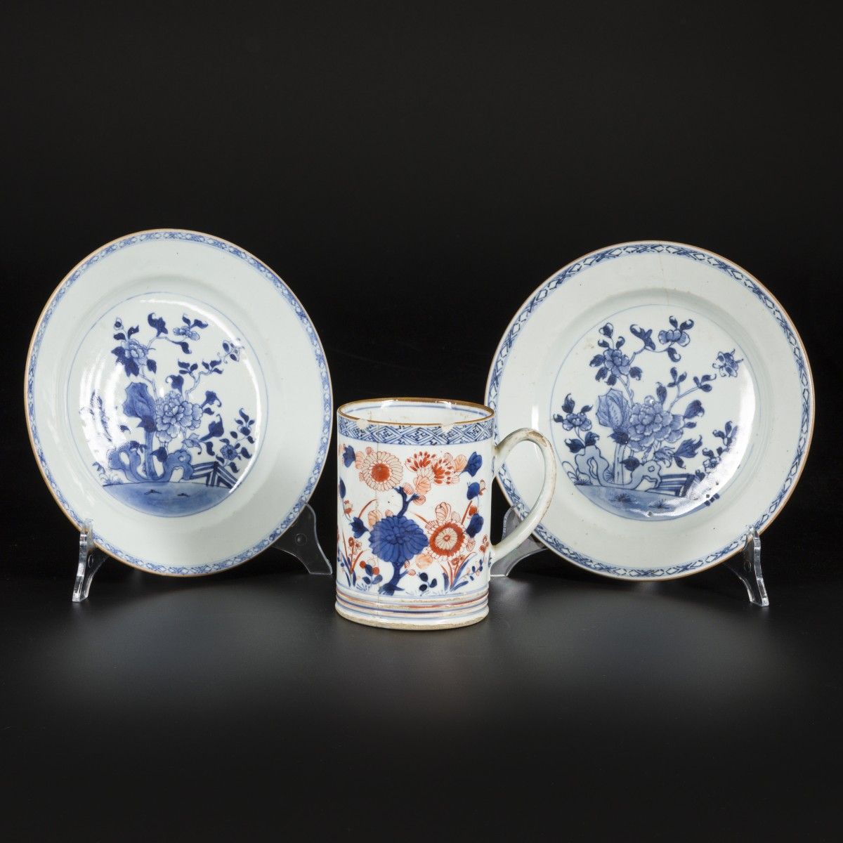 A lot comprised of (2) porcelain plates with floral decoration and a porcelain m&hellip;
