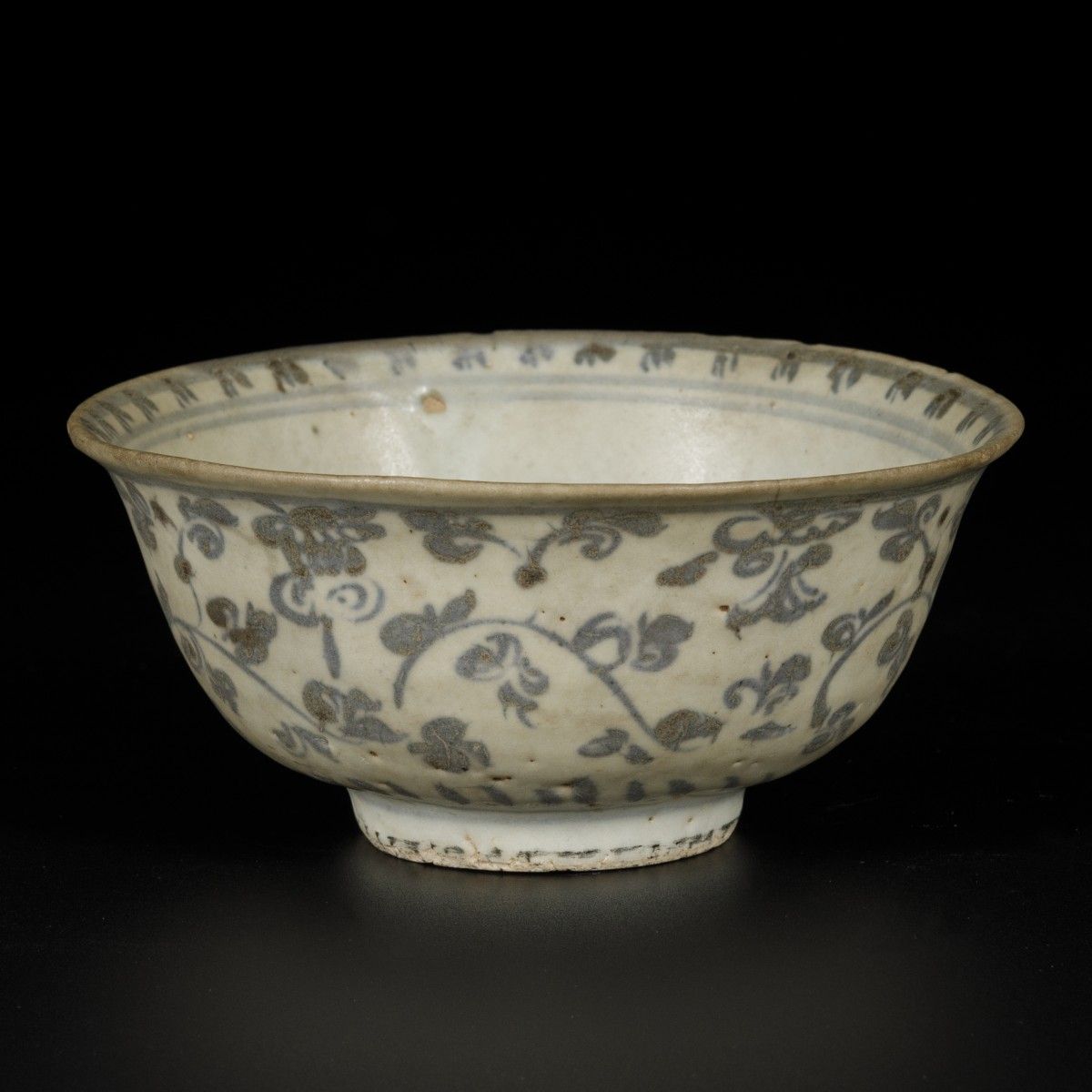 A porcelain bowl decorated with flowers, China, Ming. Dim. 7 x 15 cm. Chips. Sti&hellip;