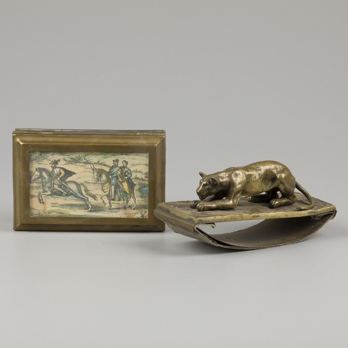 A bronze cast blotter with lurking lioness, together with a copper box for playi&hellip;