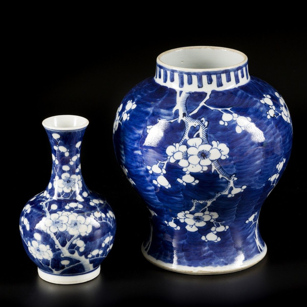 A lot comprising porcelain items a.W. A lidded vase and a pipe vase with Prunus &hellip;