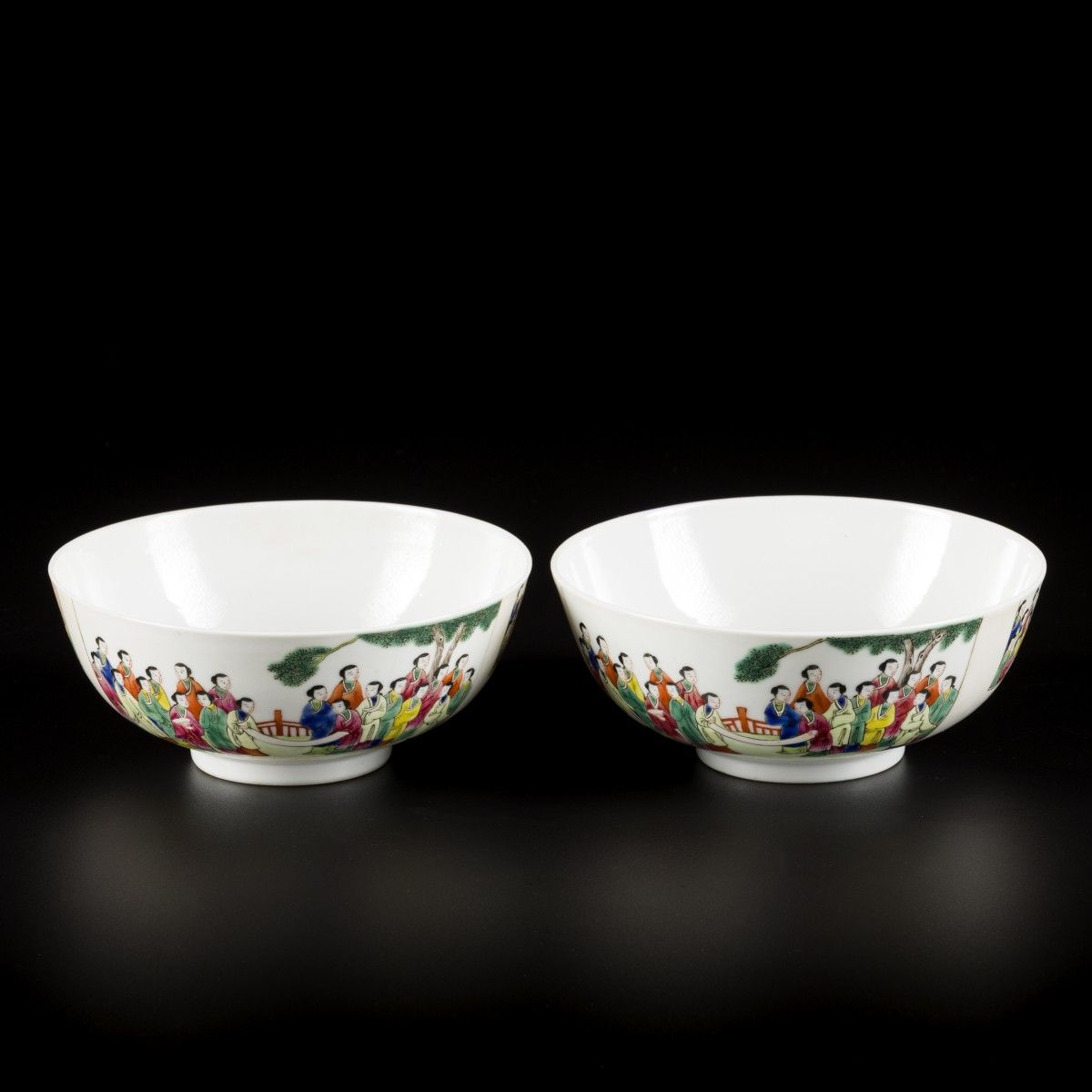 A set of (2) porcelain bowls with decoration of pupils in a garden, marked Qiang&hellip;