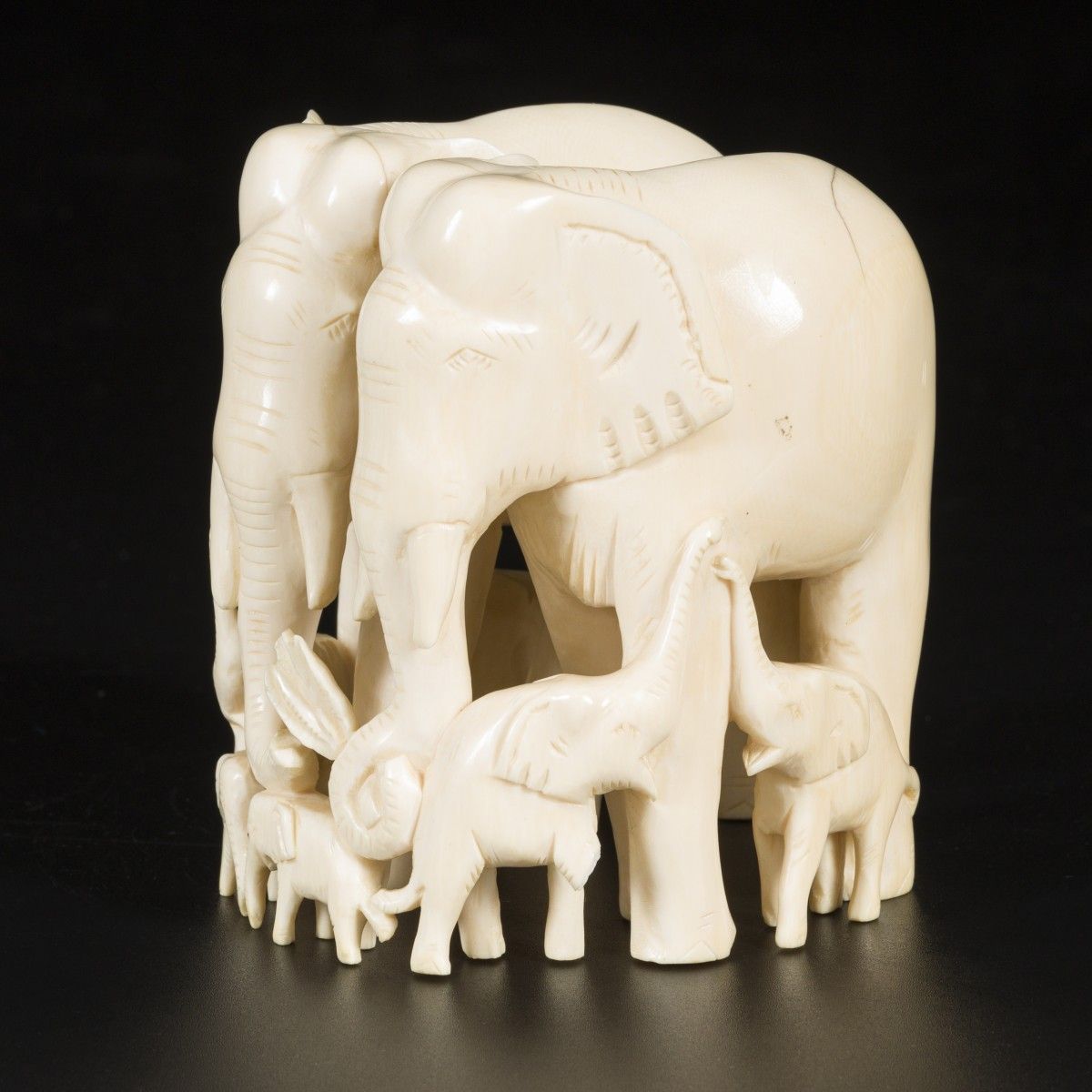 An ivory carving depicting a group of elephants, DRC, ca. 1920/30. Dim. 11.5 x 8&hellip;