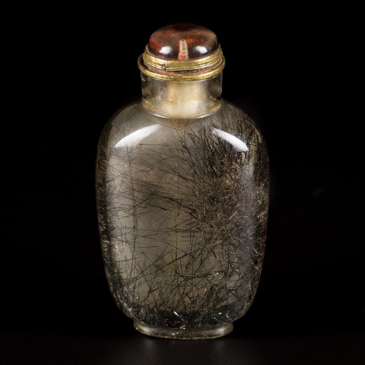 A snuff bottle, rutile quartz with hair, China, 19th century. H. 8 cm. Estimatio&hellip;