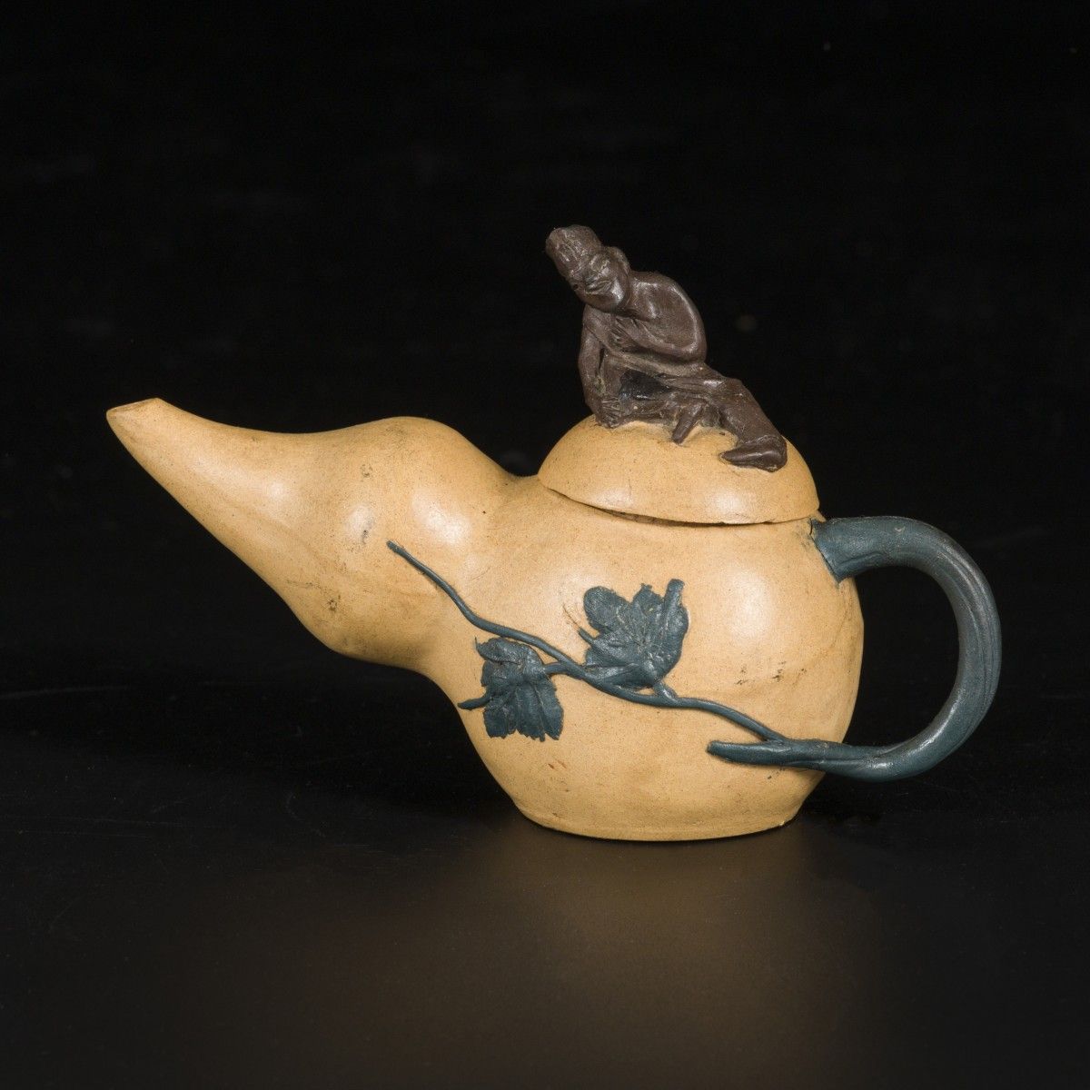 A gourd-shaped Yixing teapot, marked underneath, China, 20th century. Abm. 10 x &hellip;