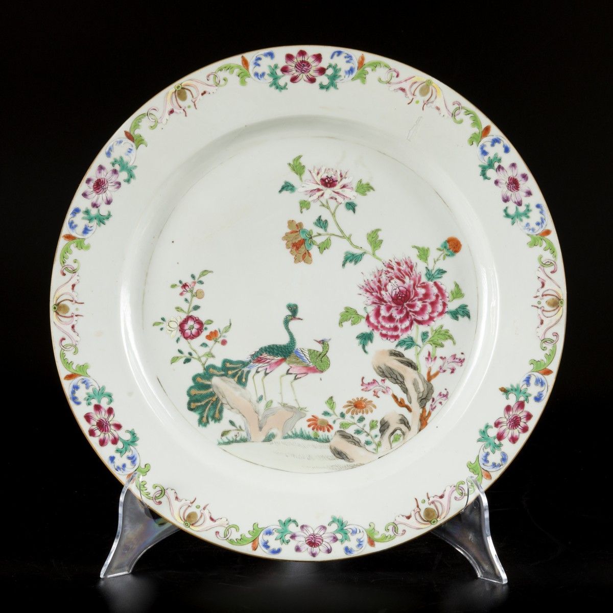 A porcelain famille rose charger decorated with two peacocks, China, Qianglong. &hellip;