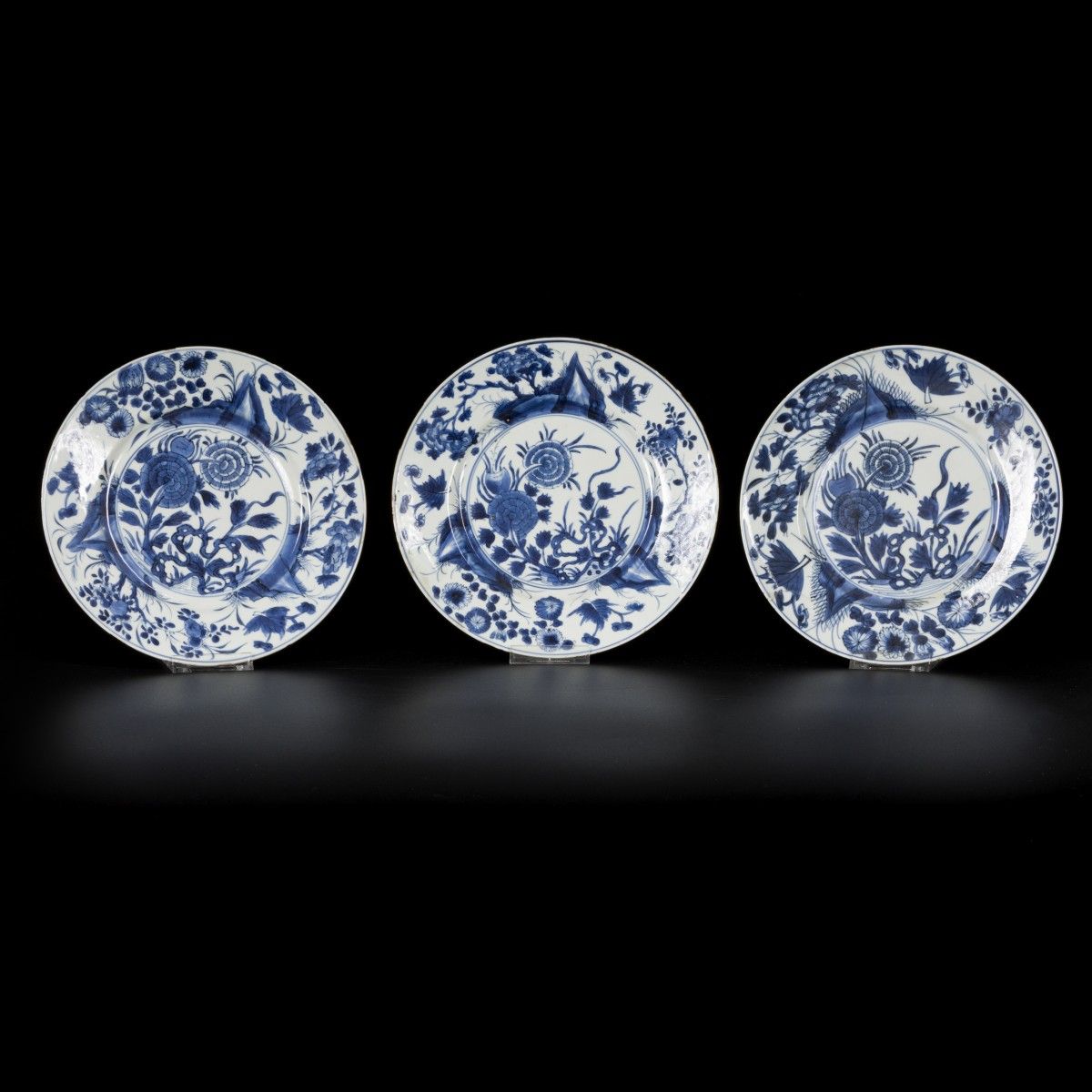 A set of (3) porcelain plates with floral and rock decoration, China, Kangxi. Di&hellip;