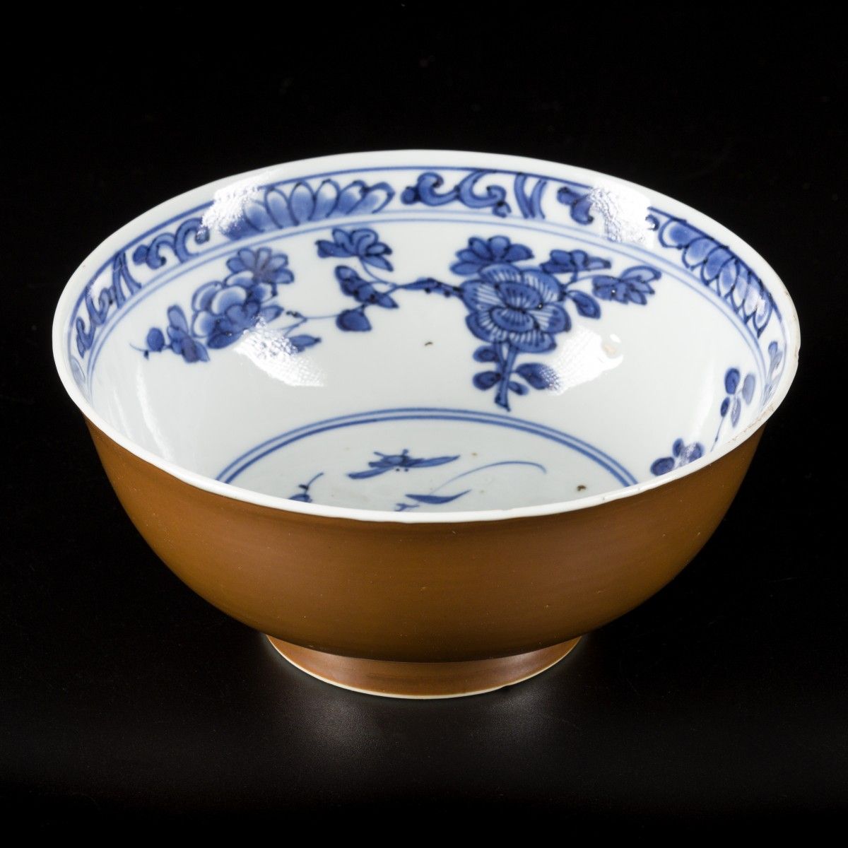 A porcelain bowl with capuchin exterior and floral decoration in the interior, m&hellip;