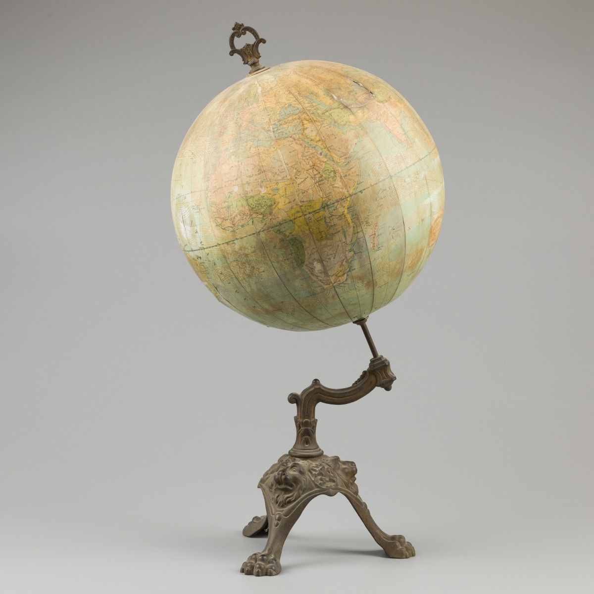 An "E Girard & A. Boitte, Paris" terrestial globe on cast metal stand with lions&hellip;