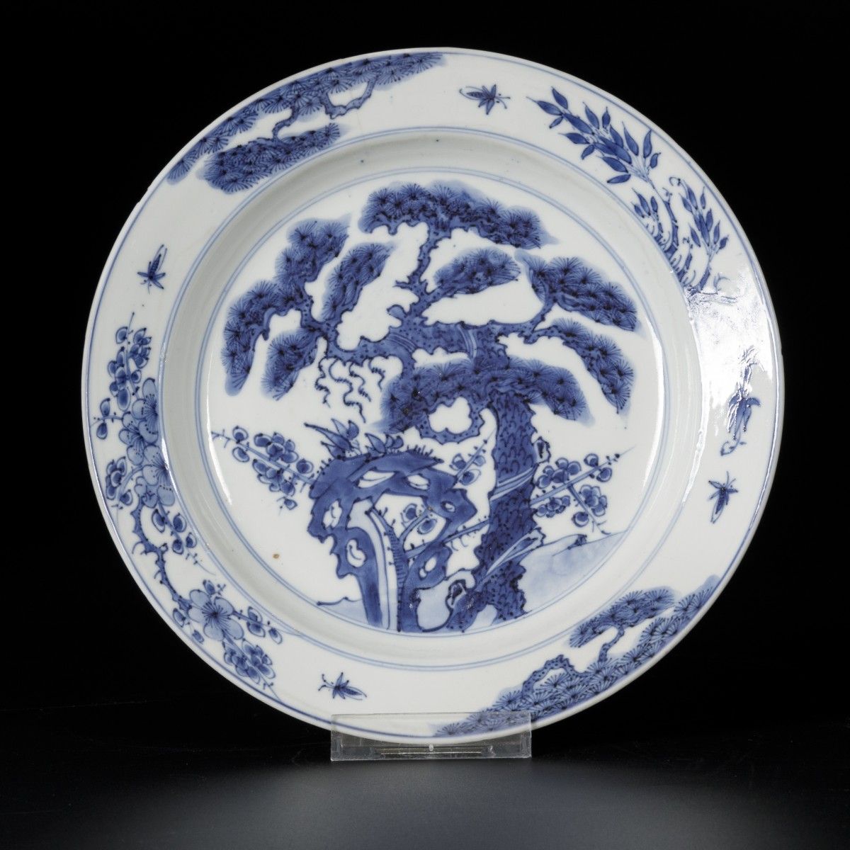 A porcelain plate with landscape decor, marked Chenghua, China, Kangxi. 
Diam. 2&hellip;
