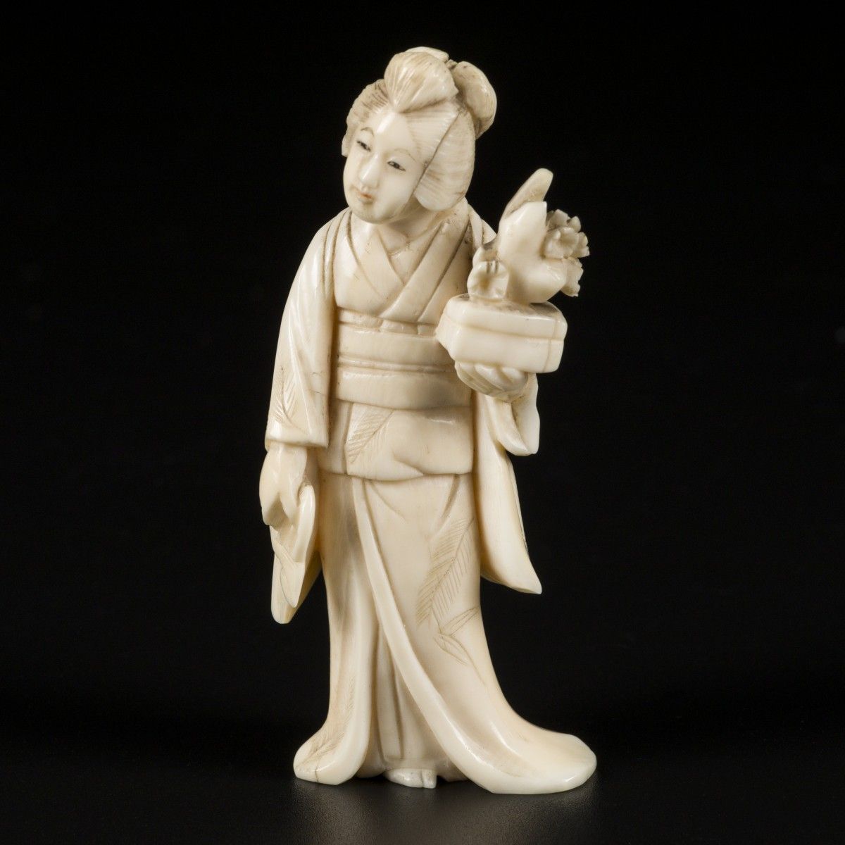 An ivory okimono of a Japanese lady wih a bonsai tree. Japan, late Meiji period.&hellip;