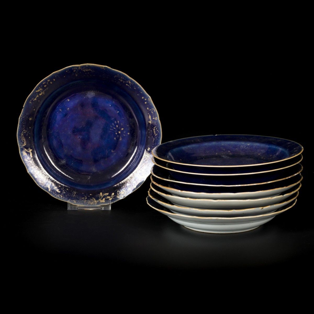 A lot comprised of (8) powder blue porcelain plates with residual of gold decora&hellip;