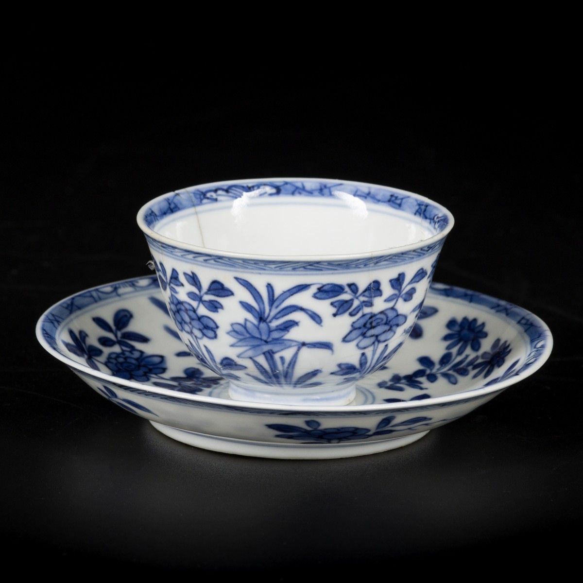 A porcelain cup and saucer with floral decorations and 6-character mark, China, &hellip;