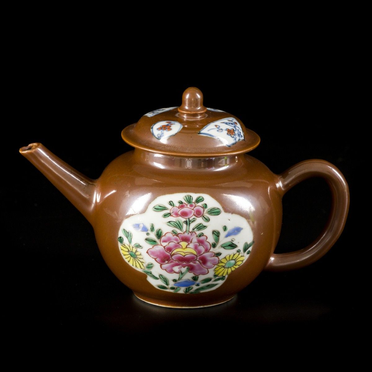 A porcelain famille rose teapot with lid, capucine exterior, China, 18th century&hellip;