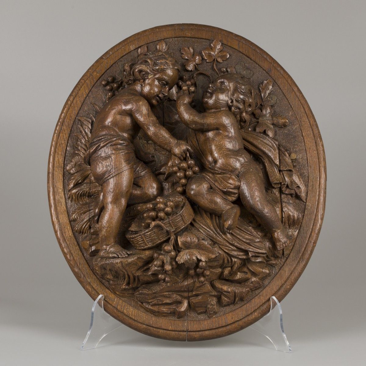 An oak carving of putti harvesting grapes (autumn), Belgium, 19th century. Small&hellip;