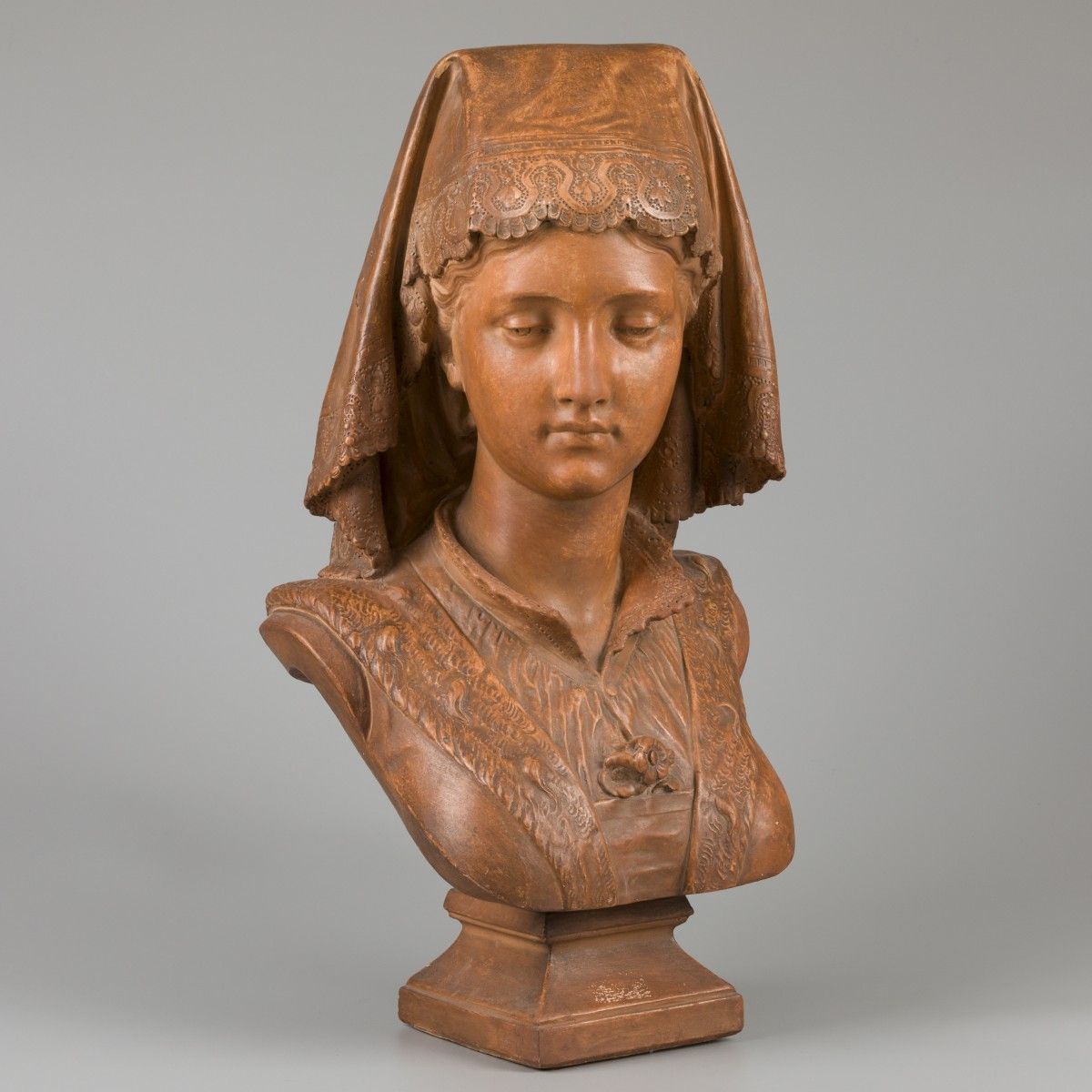 A terracotta buste of a young woman in French local dress. Sigend "Aizelin" Eugè&hellip;