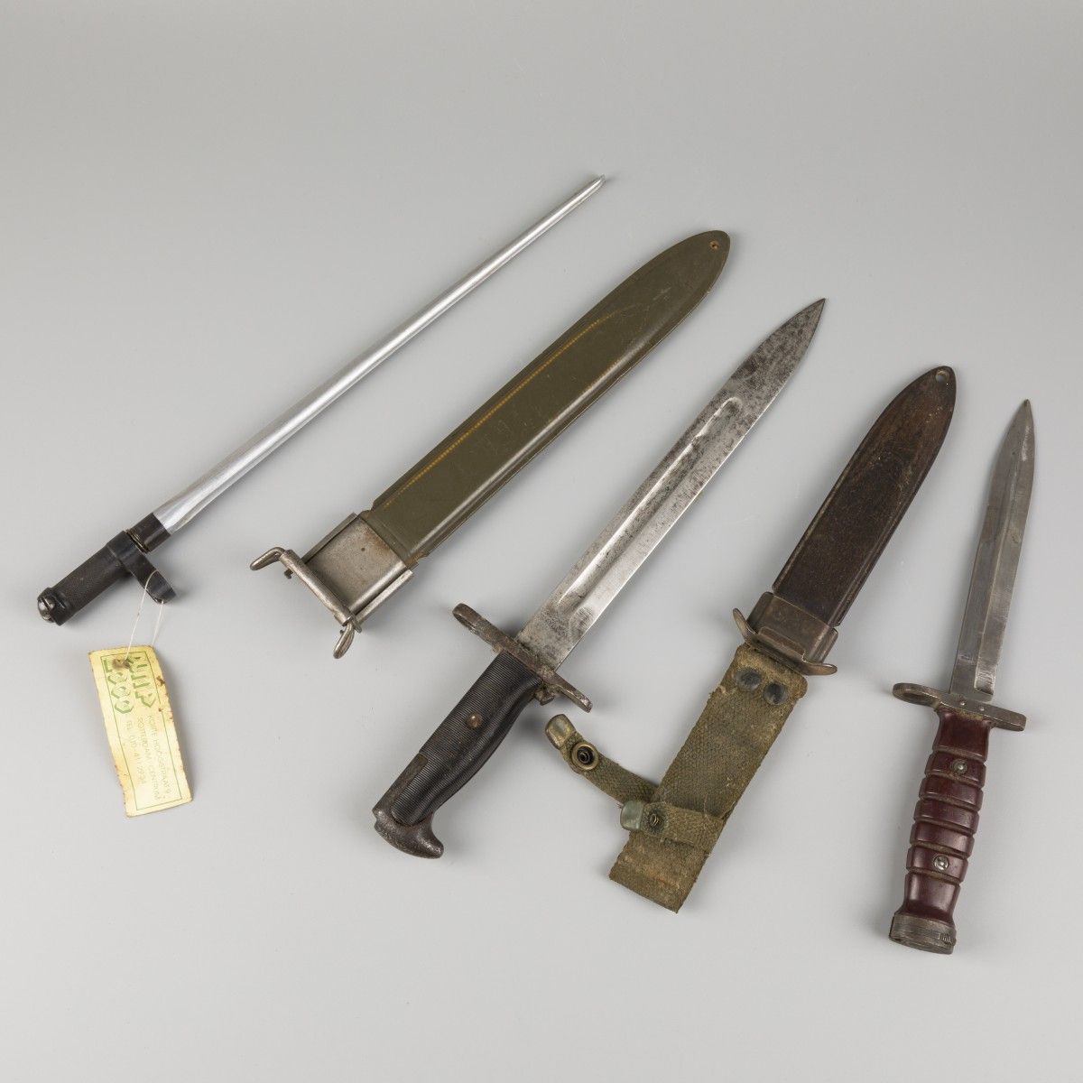 A lot comprised of (2) U.S. Bayonets and one Chinese, mid. 20th century. Une baï&hellip;