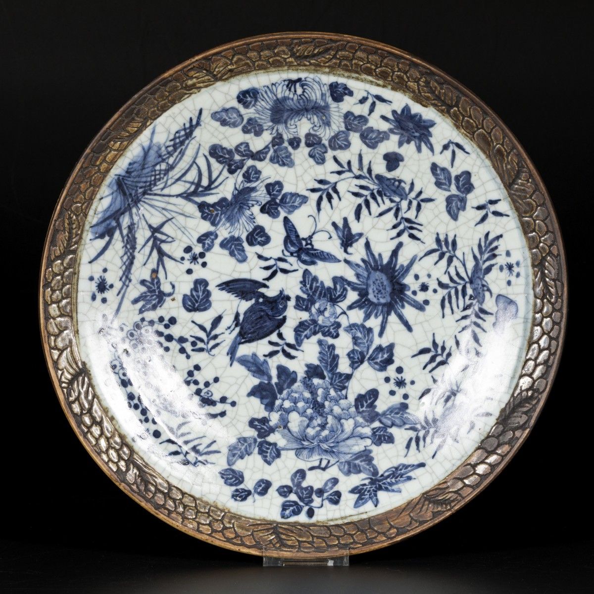 A porcelain charger with floral decorations, bird and butterflies, China, 19th c&hellip;