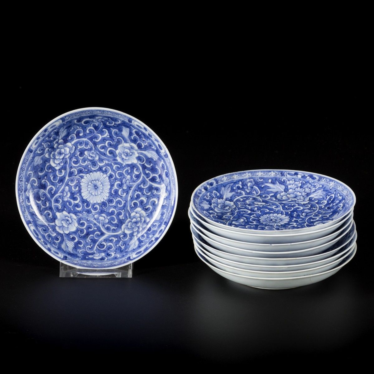 A set of (9) porcelain plates with floral decoration in reversed technique, Chin&hellip;