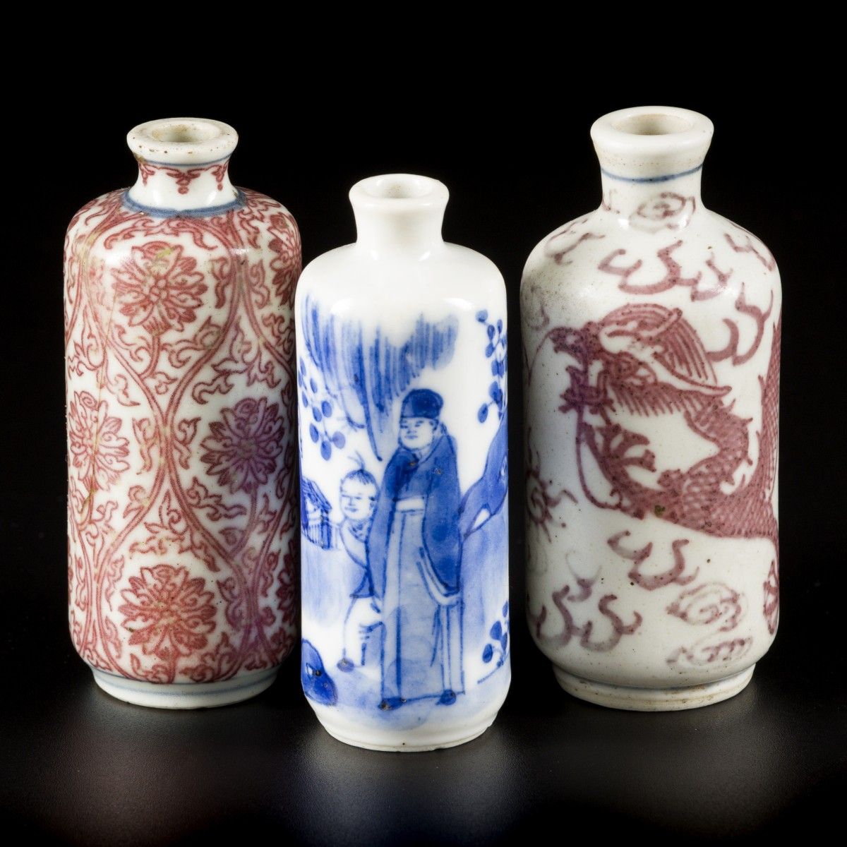 A lot comprised of (3) porcelain snuff bottles a.W. Two with 'iron red' decor, C&hellip;