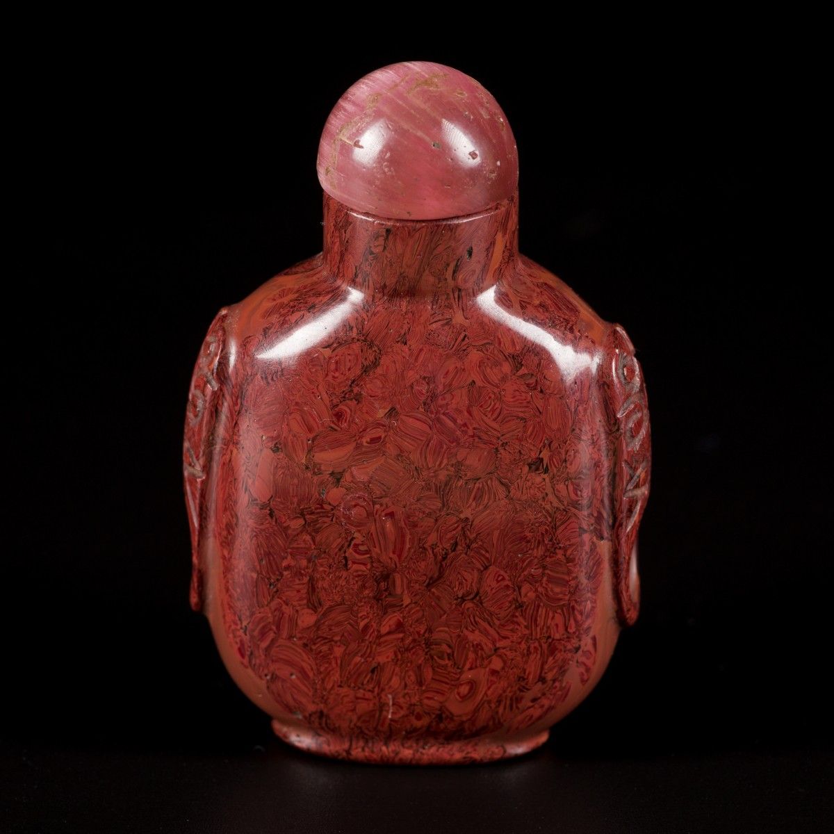 A stone snuff bottle with lion heads, China, 1st half 20th century. H. 7 cm. Sti&hellip;