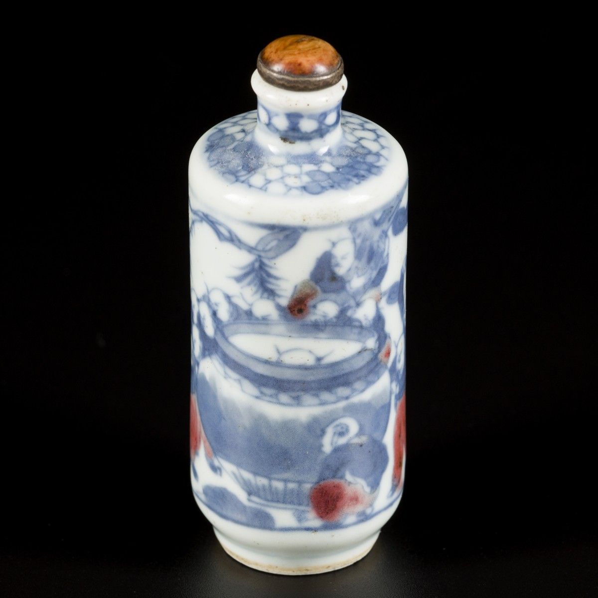 A porcelain iron-red snuff bottle decorated with playing kids around a fish bowl&hellip;