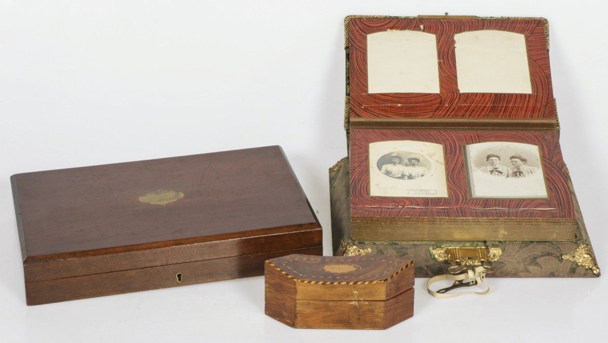 A lot comprising (2) various cases, together with a photo album, 1900 and later.&hellip;