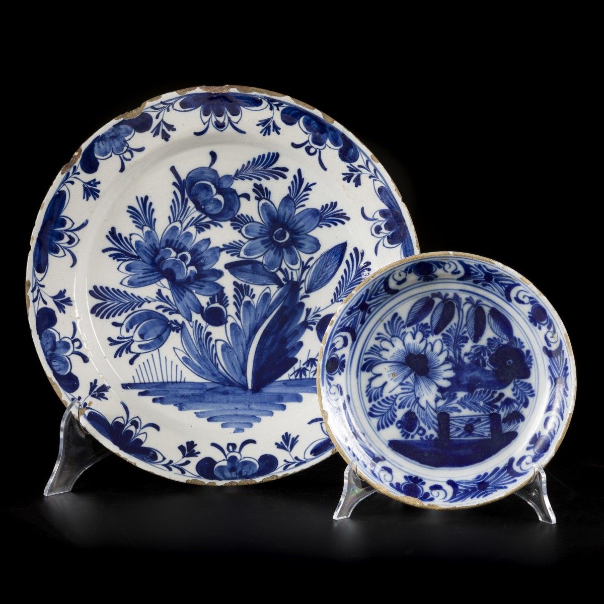A lot comprising (2) earthenware chargers with floral decorations, Delft, 18th c&hellip;
