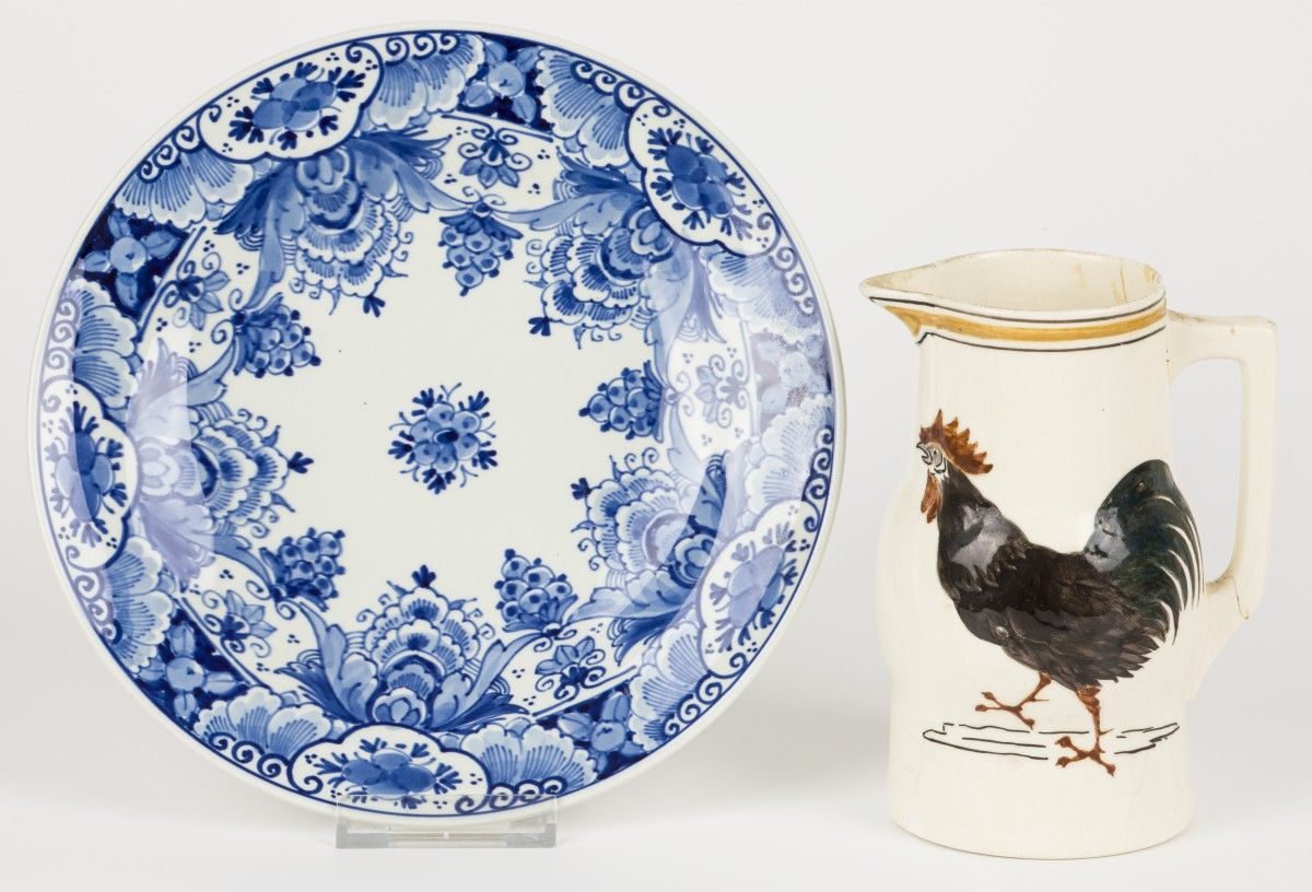 A lot of earthenware consisting of a plate and a jug, both marked Porceleyne fle&hellip;