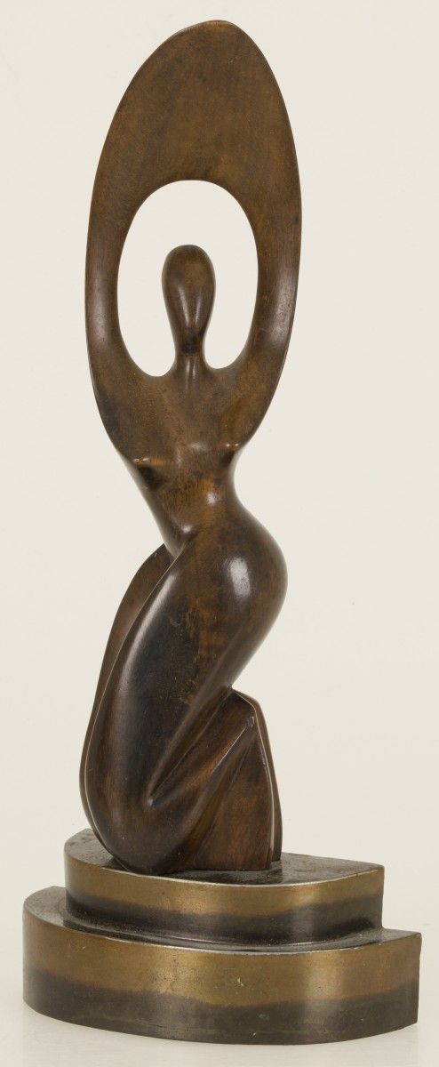 A carved wooden sculpture of a kneeling dancer mounted on a brass base, 20th cen&hellip;