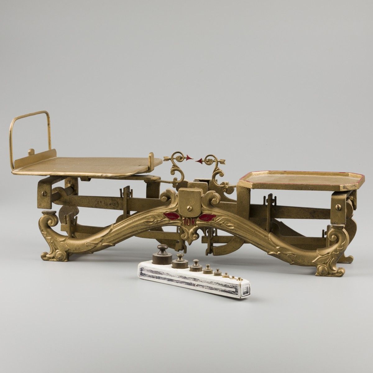 A set of scales on a cast brass pediment, Sweden, 19th century. With non-matchin&hellip;