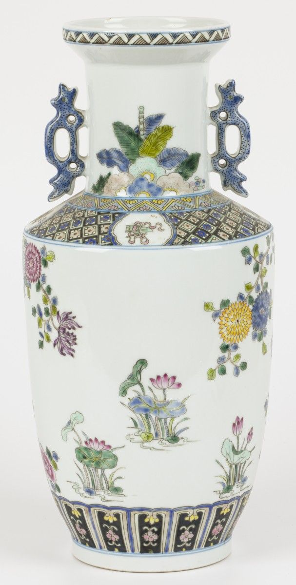 A porecelain vase decorated with peonies and birds. China, 2nd half 20th C. Mark&hellip;