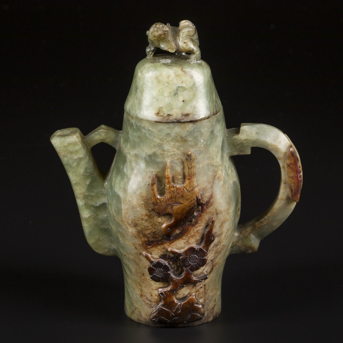 A Celadon jade teapot decorated with a lion as lid knob and relief decoration of&hellip;