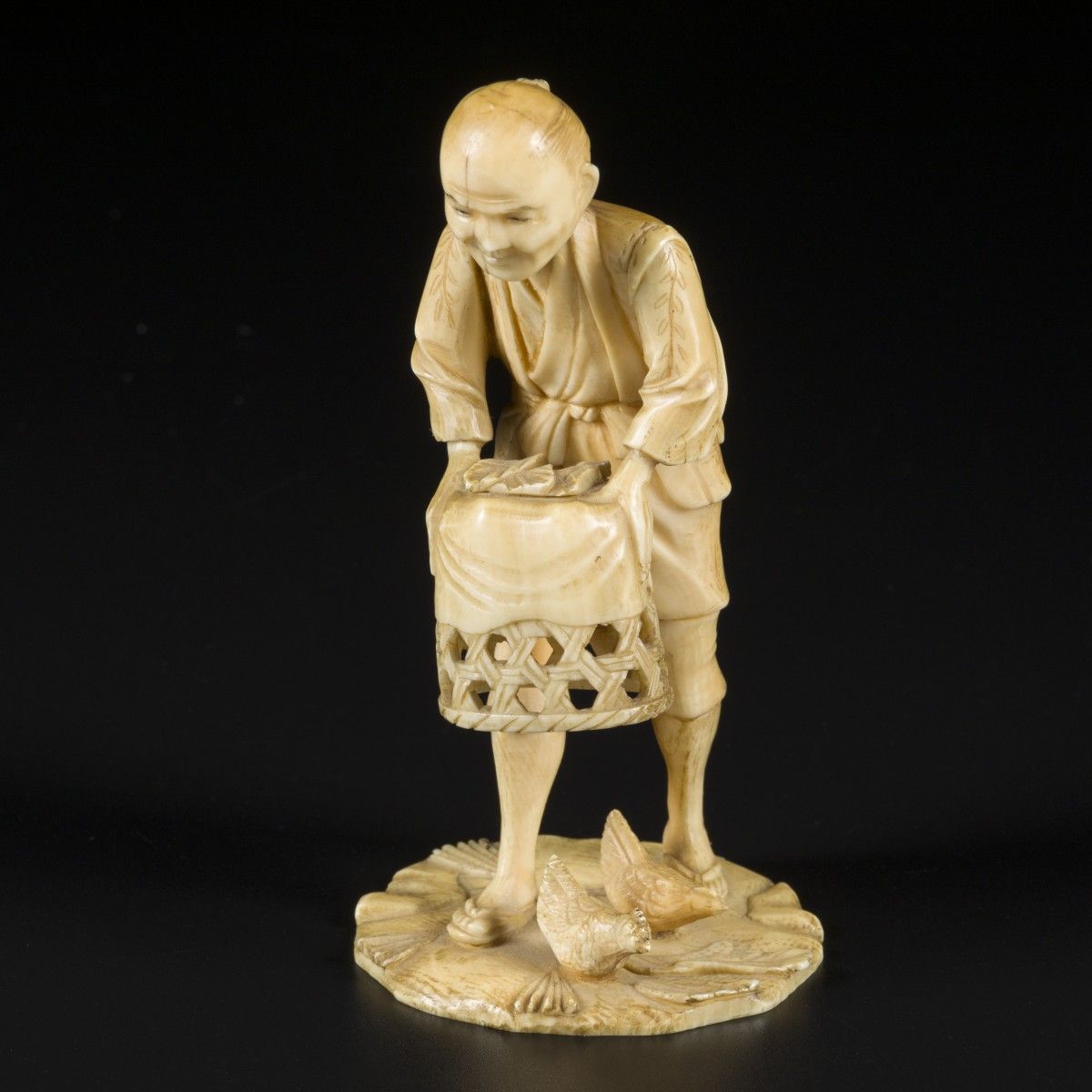 An ivory okimono depicting a man with his chickens, Japan, Meiji period, ca. 190&hellip;