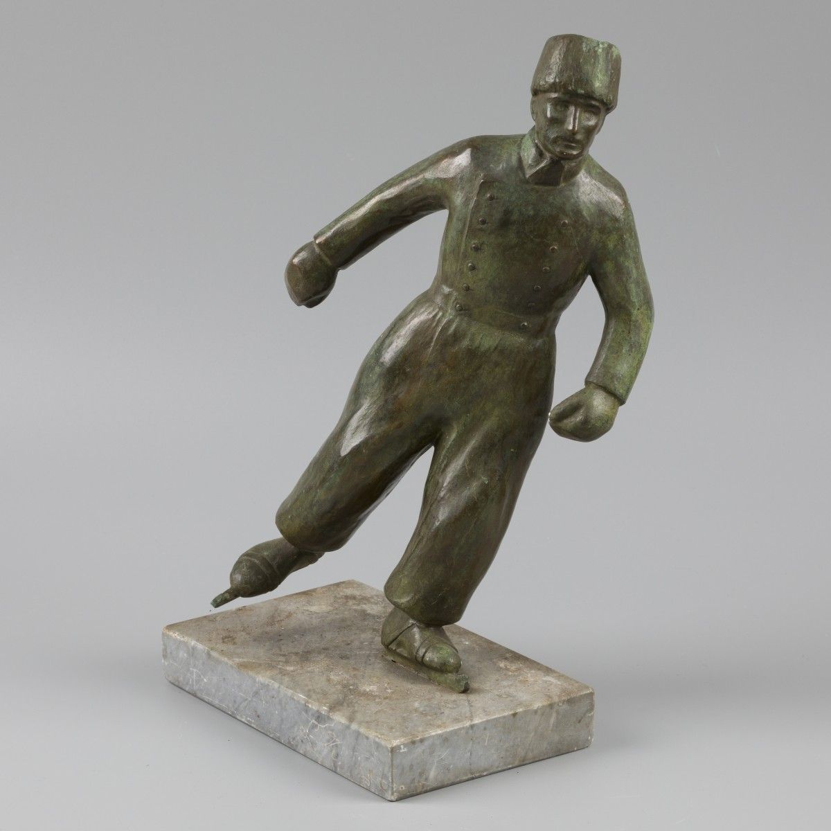 A bronze statuette of a fisherman from Volendam on skates. 35 x 21 x 12 cm.