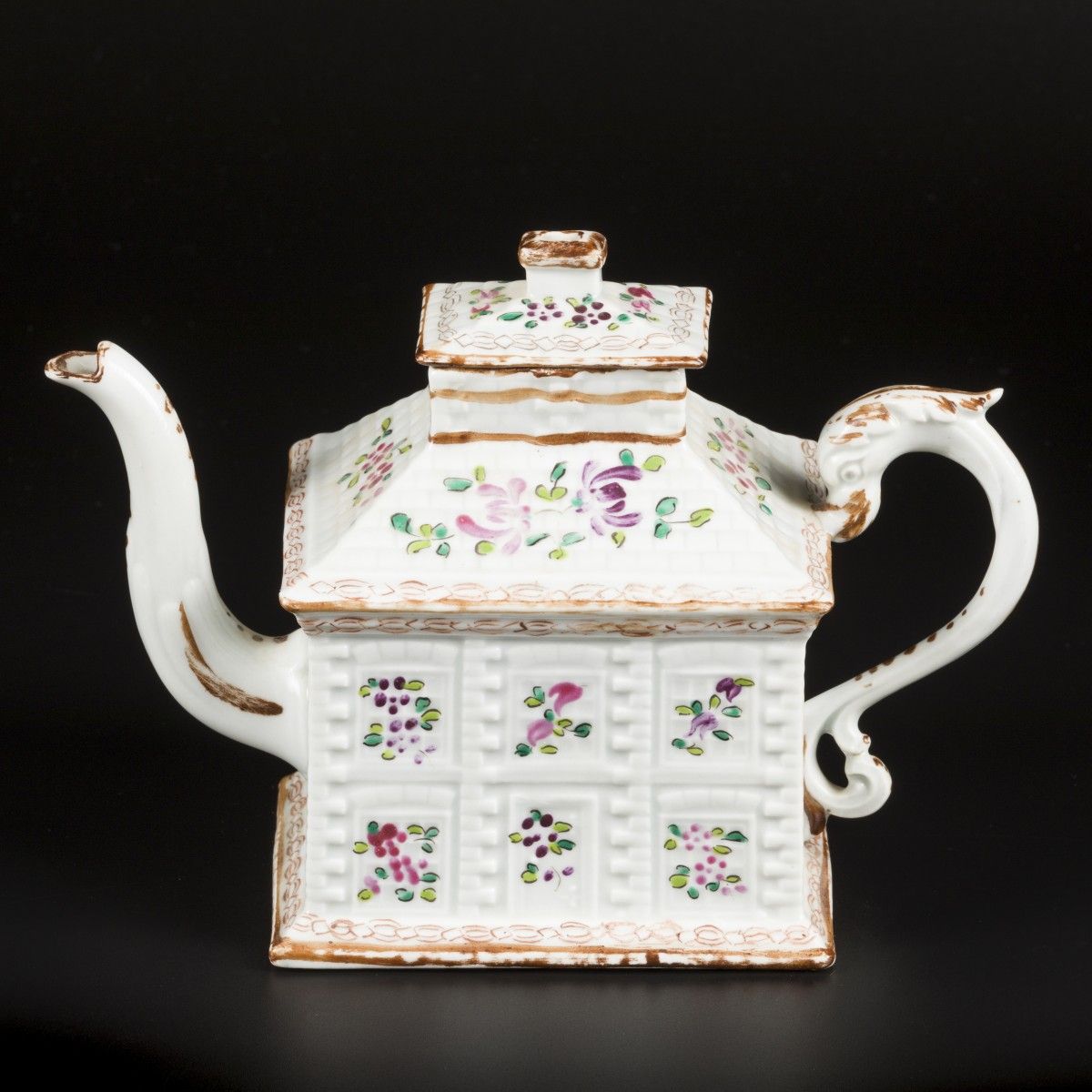 A porcelain famille rose teapot in the shape of a house. England, 19th century. &hellip;