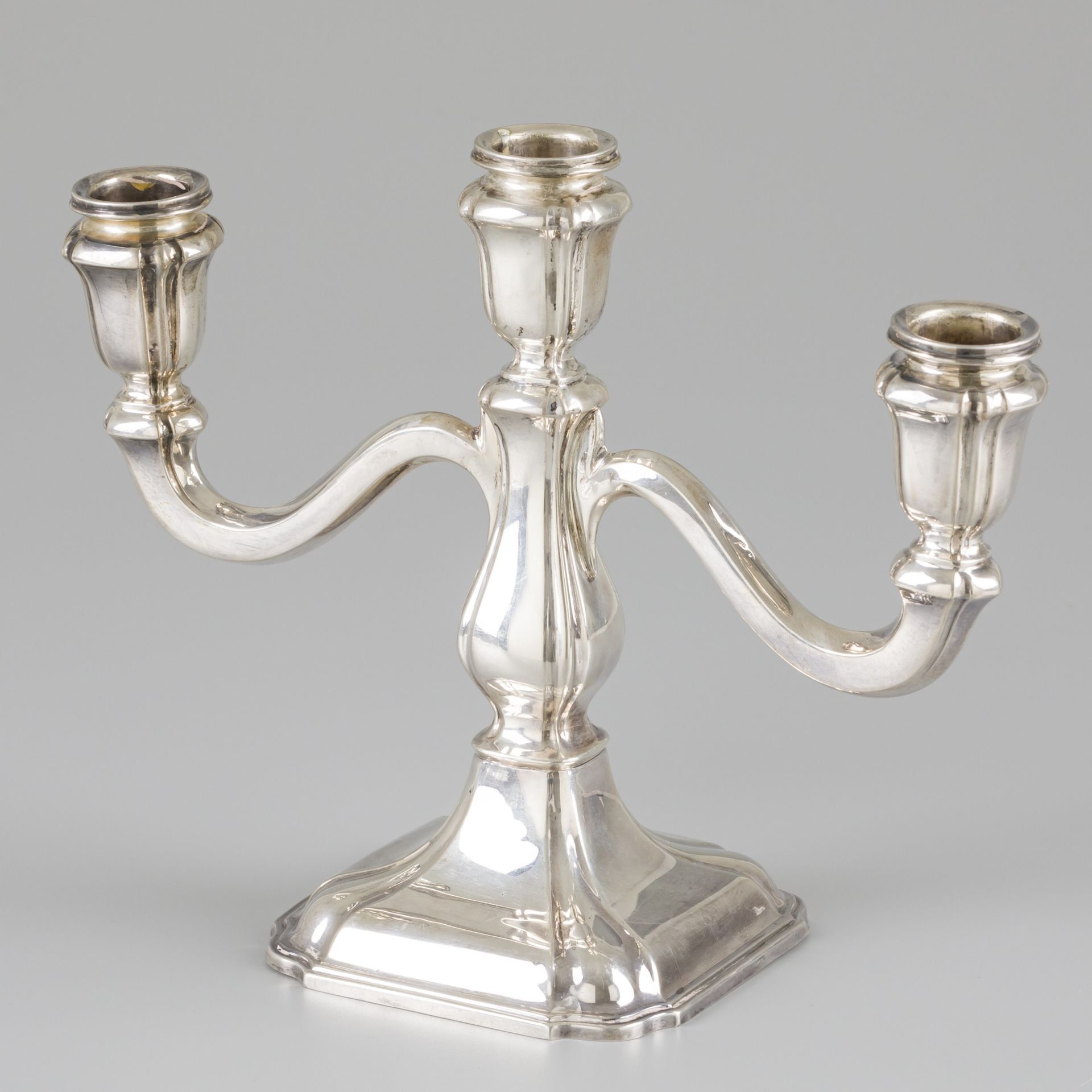 Candelabra silver. In lobed shapes and equipped with 3 arms. Belgium, 20th centu&hellip;